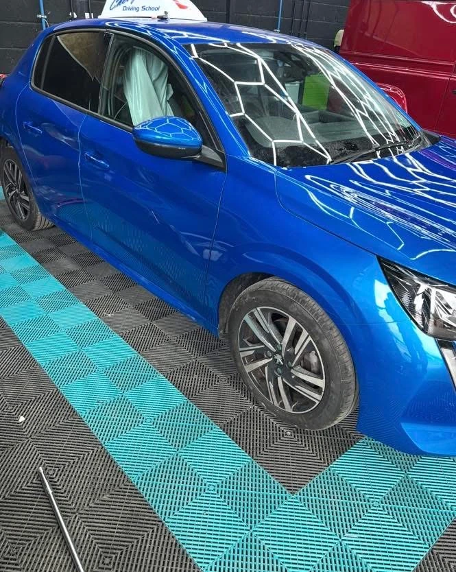 Peugeot 208 repaired driver’s side with blue paintwork and panels reassembled