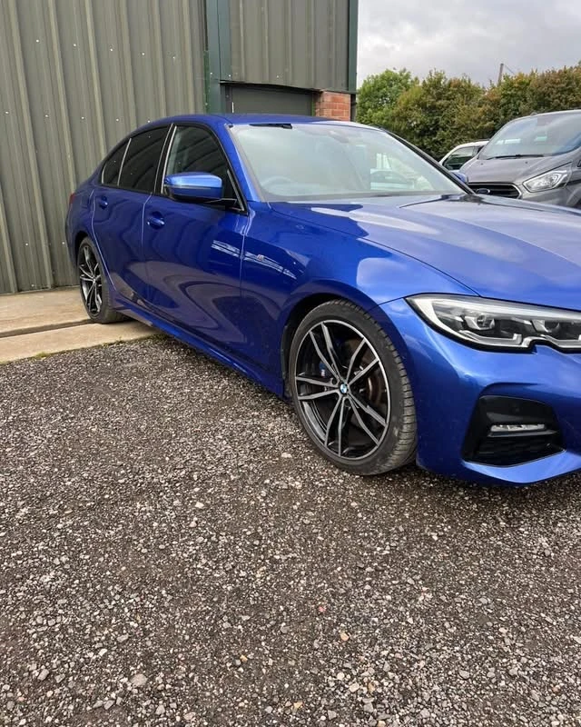 BMW 330i completed driver's side accident repair, front three-quarter view at JB Bodyworks