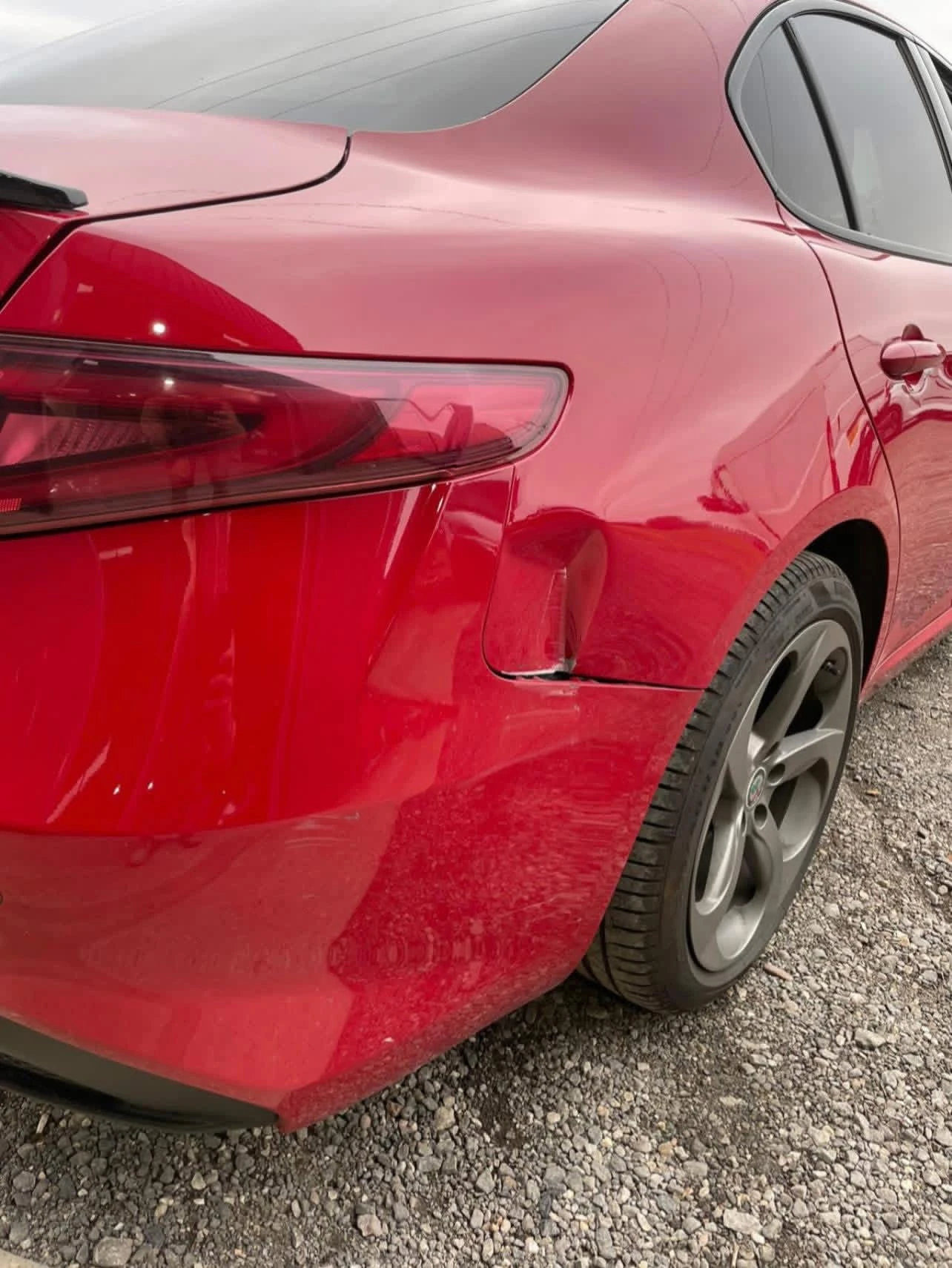 Alfa Romeo Giulia damaged offside rear quarter and bumper before repair