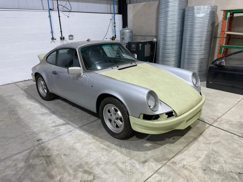 Porsche 911 front three-quarter view with bodykit panels in preparation at JB Bodyworks
