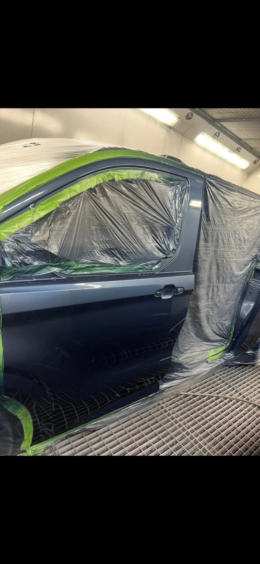 Ford Transit Custom masked front passenger door during adjacent-panel paint blending